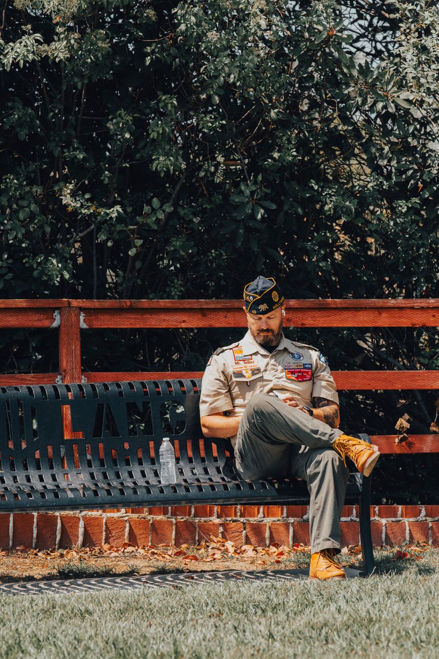 veteran sitting on park bench in los angeles