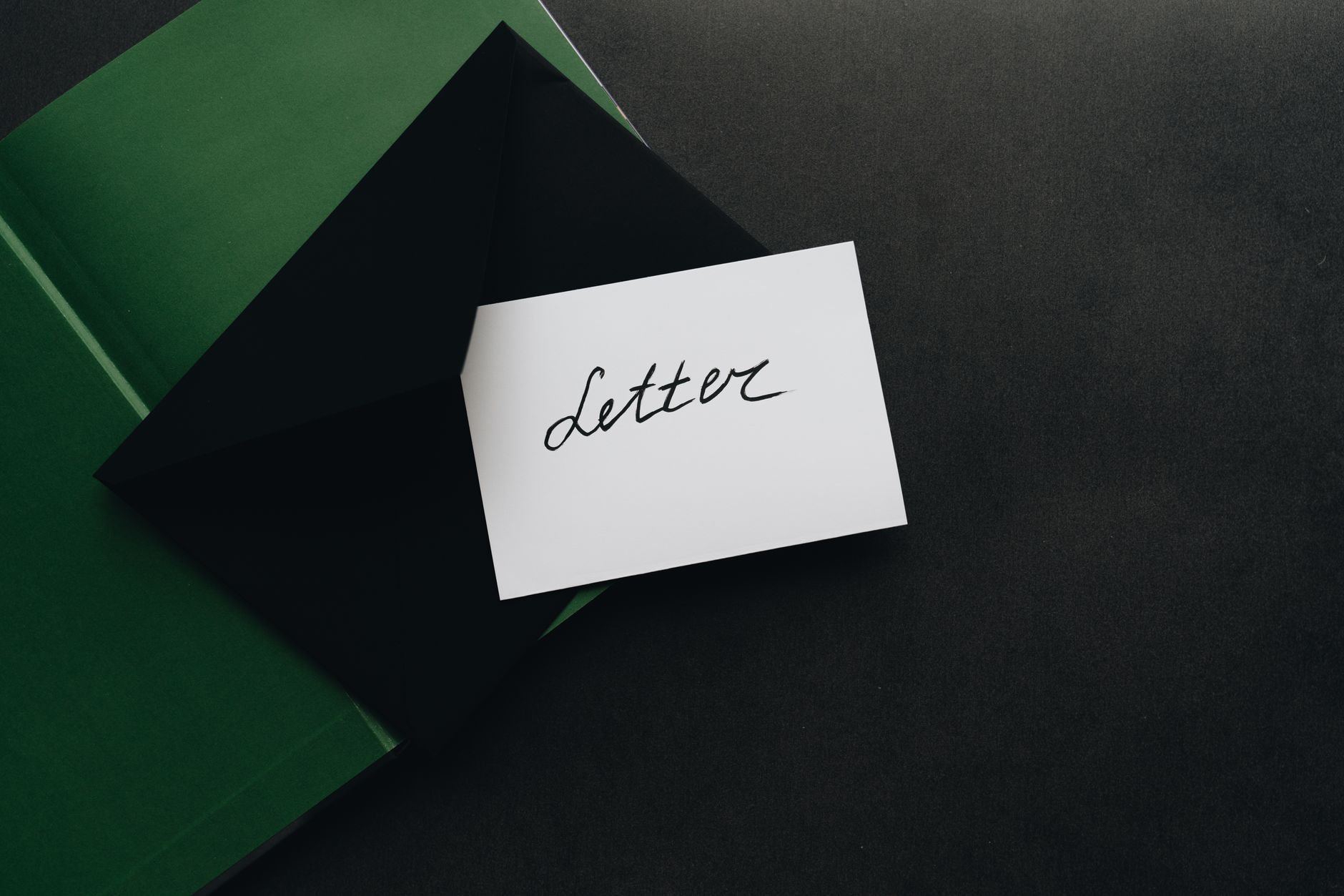 white card on top of an envelope