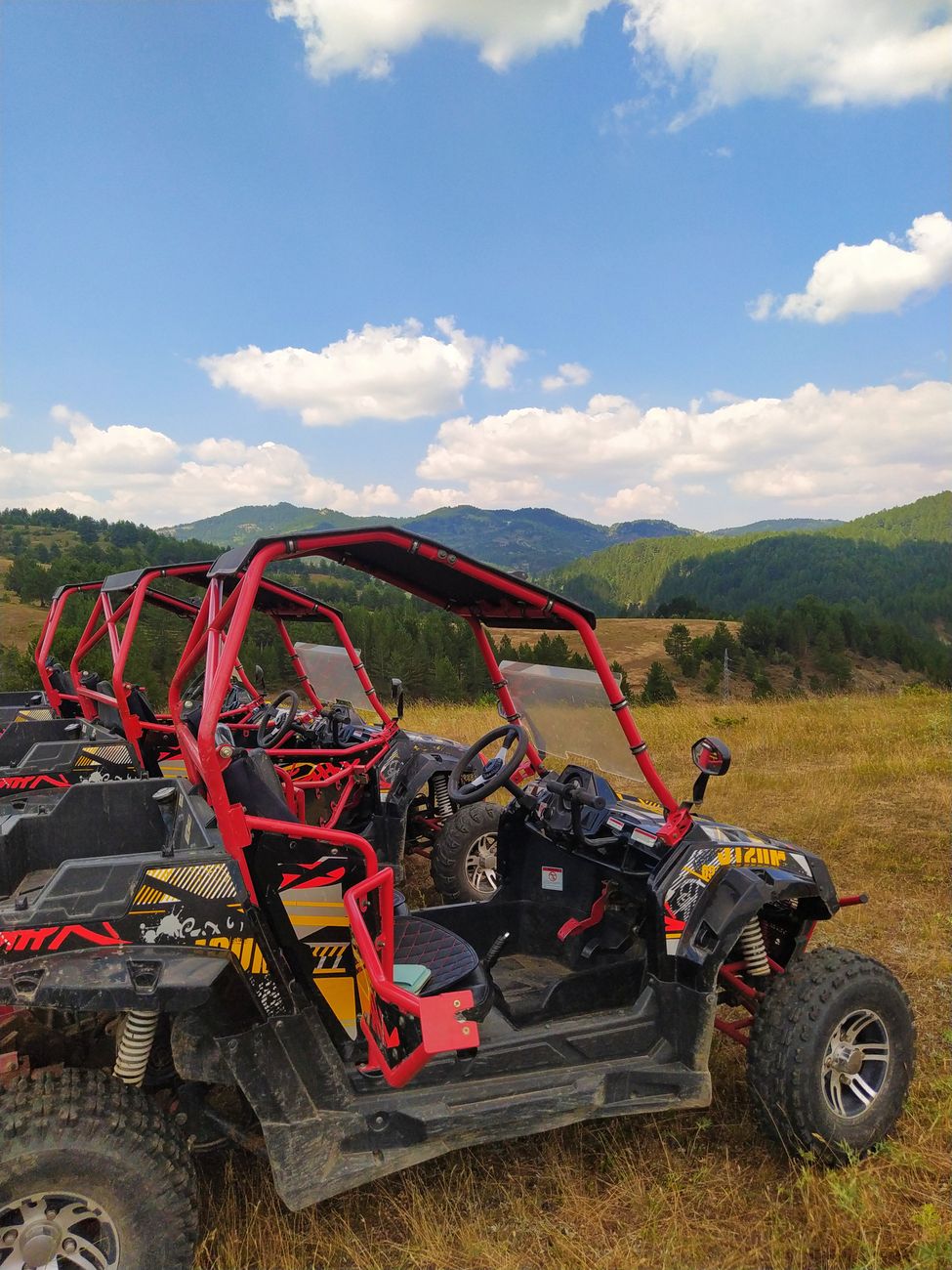 utv vehicles in row on field