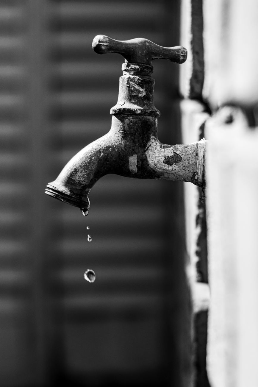 vintage water tap dripping in black and white